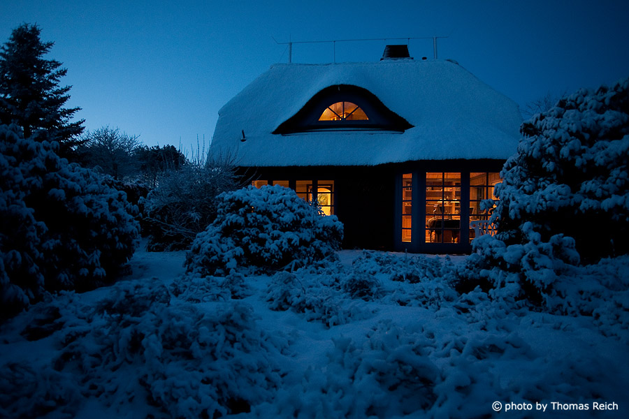 Snowy Frisian house in Norddorf, Island of Amrum