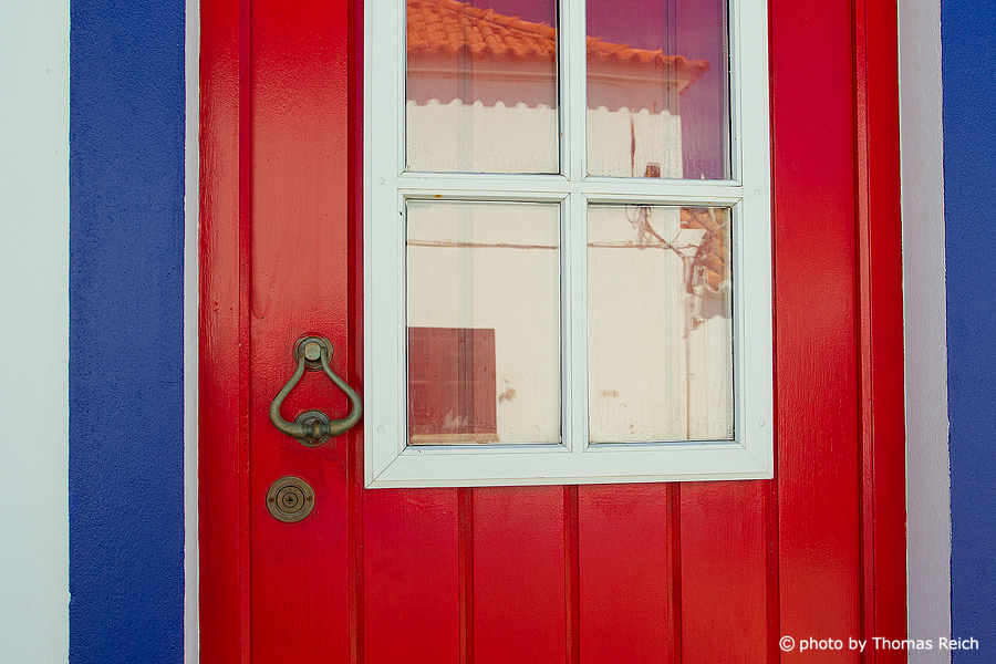 Red door in Porto Covo, Alentejo, Portugal