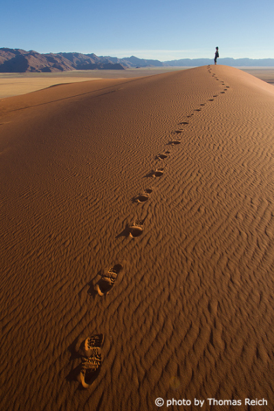 Walking on sand dunes in Namibia