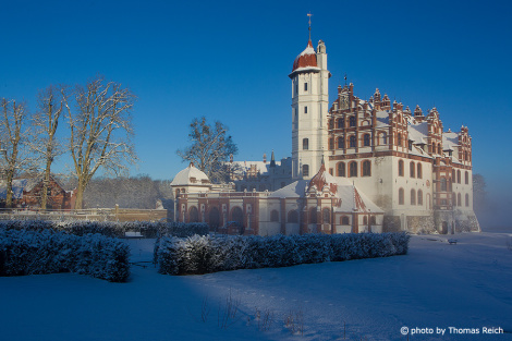 Winter castle complex Basedow with blue sky