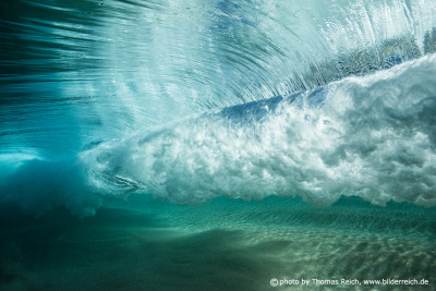 Underwater photo of breaking ocean wave