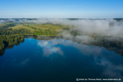 Fog over lake Schorssow, Germany