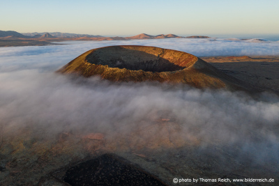 Sea of clouds below the summit of volcano hondo