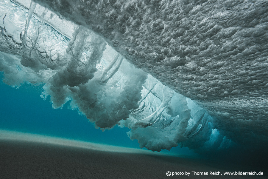 Underwater view of breaking wave