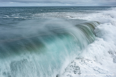 Massive waves crash along coast