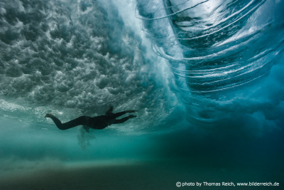 Girl diving with big wave vortex