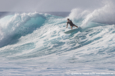 Surfer in big ocean wave